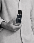 Man holding Homme evening eau de parfum 50ml bottle by Adam Pare